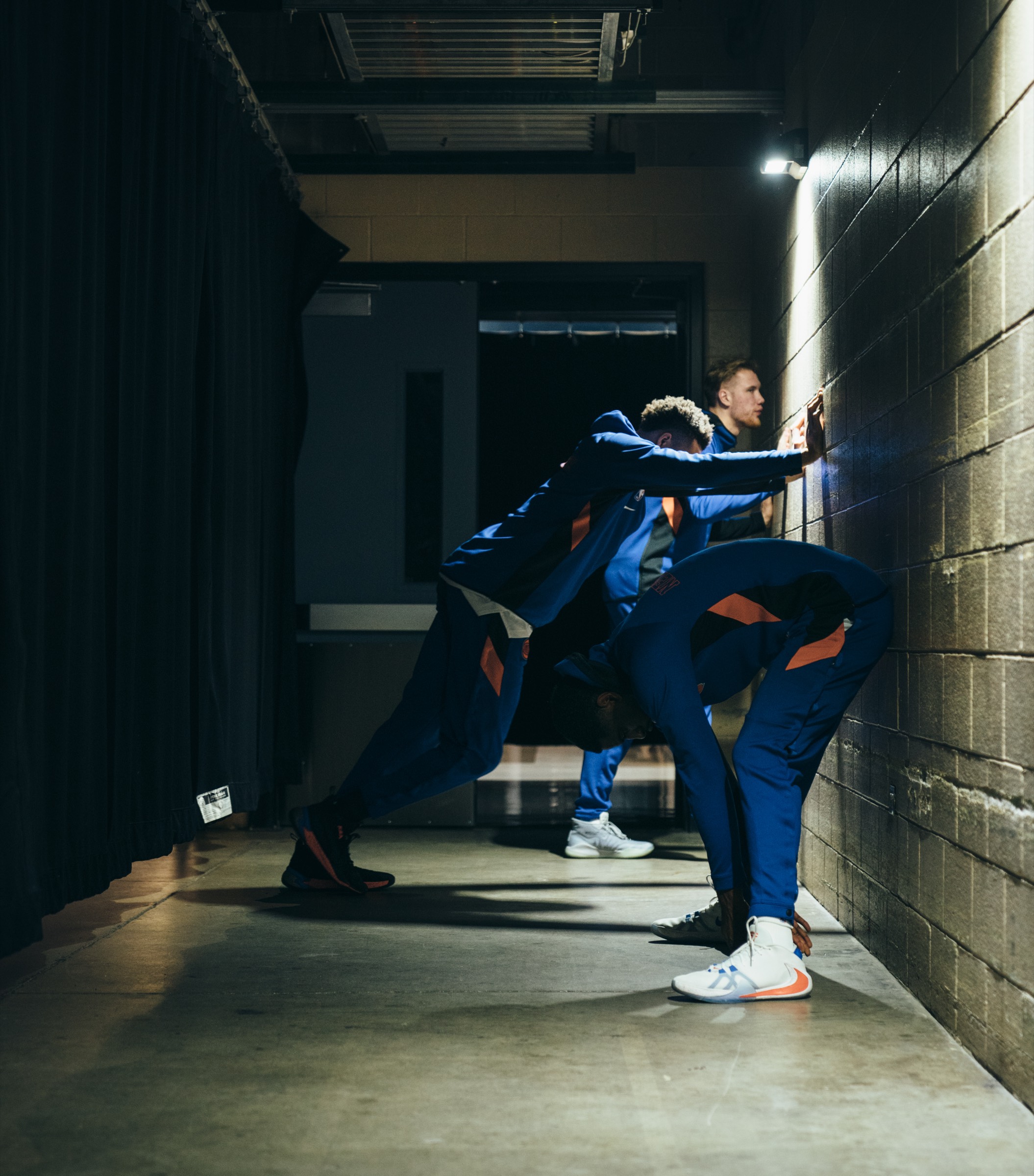 Players stretching in the tunnel